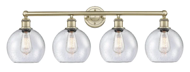 Shock - Resistant Industrial Lighting for Vibrating Machinery AreasDowntown Urban Four Light Bath Vanity