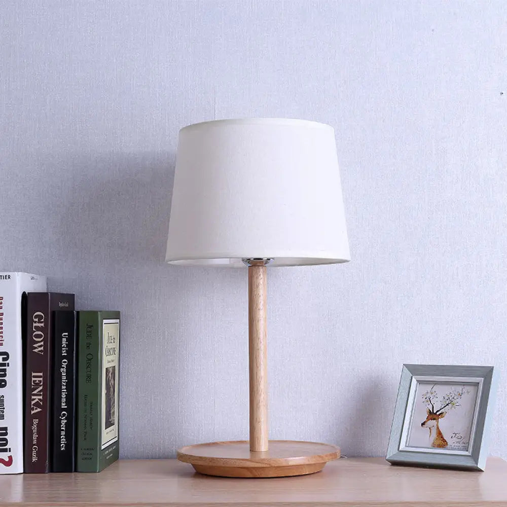 fabric table lamps with a linen shade for a relaxed and breathable lookfabric table lamps with a linen shade for a relaxed and breathable lookModernist Barrel Task Lamp: 1-Bulb White Table Light with Beige Wood Base